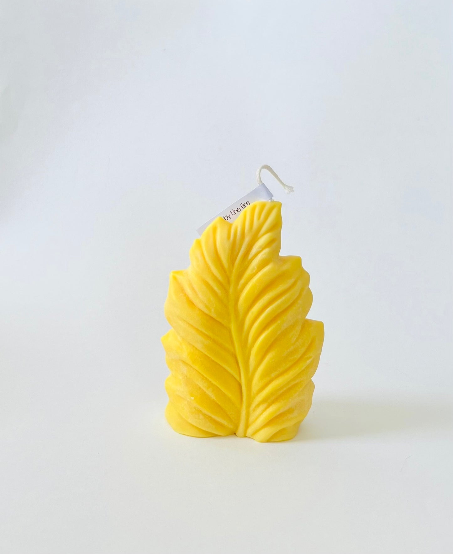 Palm leaf pillar candle